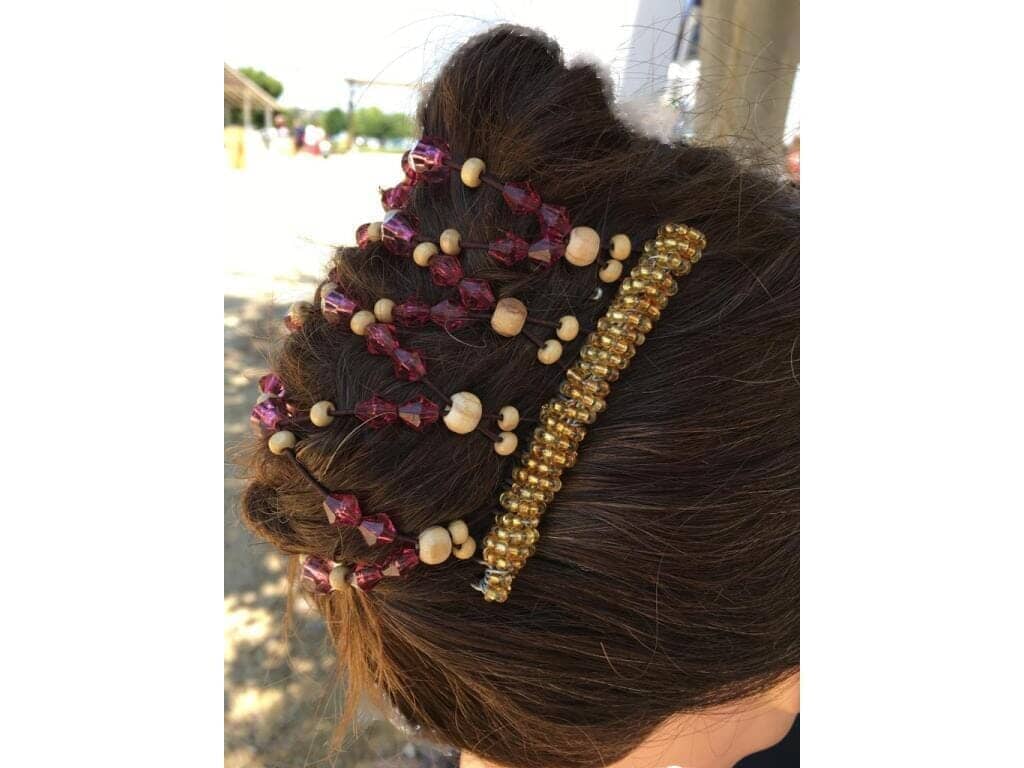 Pretty lady showcasing our 9 Tong Wire Hair Clip in a french twist hairstyle