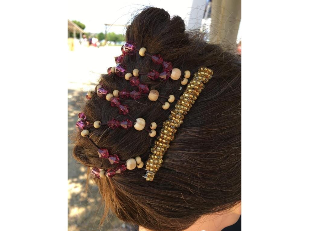 Lady showcasing our 9 Tong Wire Hair Clip in a french twist hairstyle