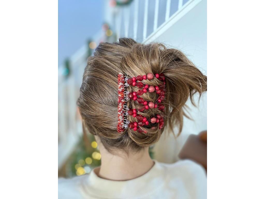 Young woman showcasing our African Butterfly 9 Tong Wire Hair Clips in a cascade hairstyle