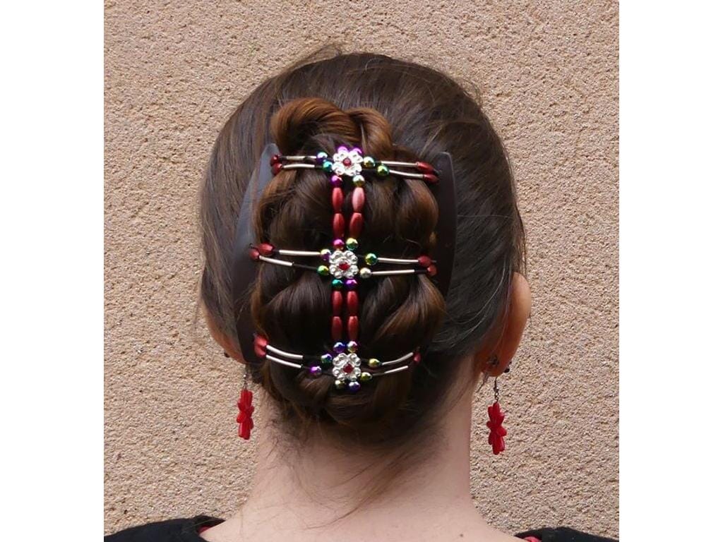 Woman wearing an African Butterfly Flowers Hair Comb in a bun hairstyle