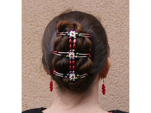 Woman wearing an African Butterfly Flowers Hair Comb in a bun hairstyle