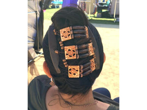 Woman showcasing our African Butterfly Tripla Thick Hair Comb in a french twist hairstyle