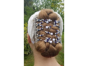 Young woman showcasing our African Butterfly 11 Tong Wire Hair Clip in a braided bun hairstyle